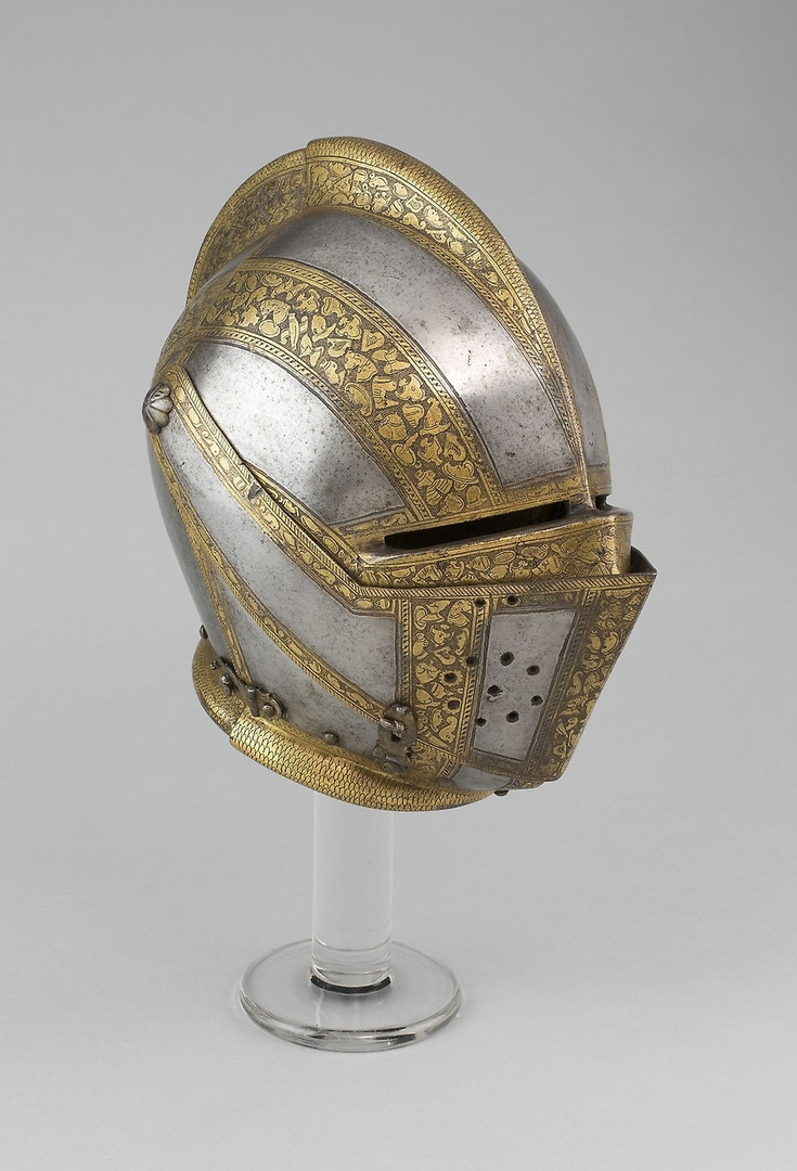 Закрытый армэ для пешего турнира у барьеров, 1550 год. Вес 4,36 кг. Материалы: сталь с позолотой, железо, латунь, кожа и бархат.